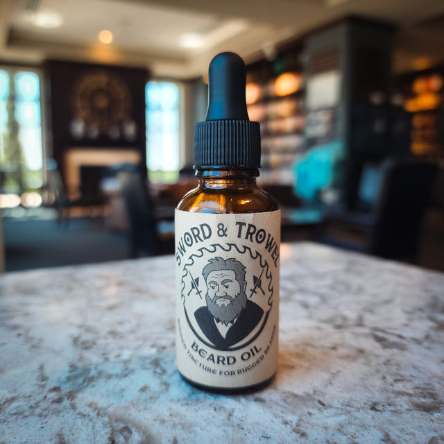 Experience the artisanal excellence of Sword & Trowel Beard Oil, meticulously handcrafted by a local pastor. Nourish your beard with the finest ingredients, leaving it soft, healthy, and irresistibly fragrant with a blend of cedarwood, orange peel, and a