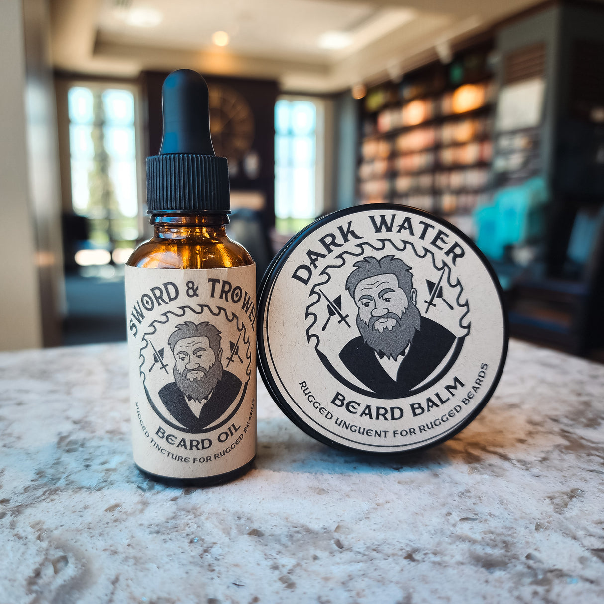 Unleash the power of a well-groomed beard with our Sword & Trowel Beard Care Bundle. Infused with the invigorating scents of warm cedarwood, zesty orange peel, and rich coffee, this bundle includes premium handmade beard oil and balm for the ultimate groo