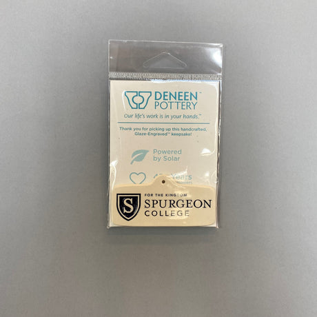 These Glaze Engrave ornaments from Deneen Pottery come with a gold hook.
The color option refers to the fill, seen especially in the seals.