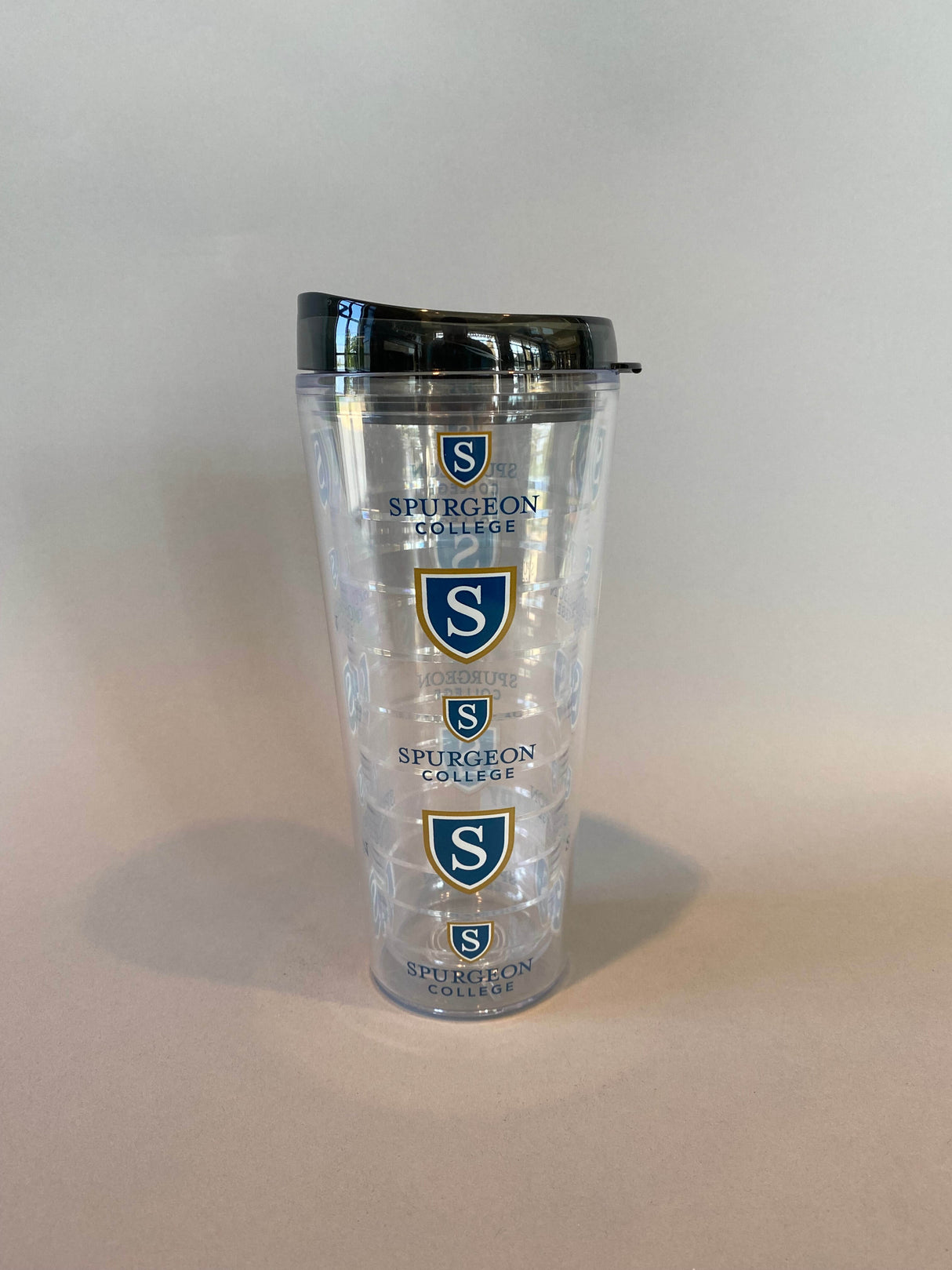 This 22 oz double wall tumbler keeps drinks hot/cold, is microwave and dishwasher safe, and comes with a straw.