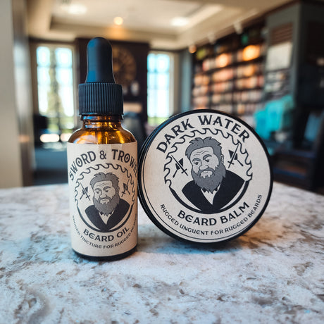 Unleash the power of a well-groomed beard with our Sword & Trowel Beard Care Bundle. Infused with the invigorating scents of warm cedarwood, zesty orange peel, and rich coffee, this bundle includes premium handmade beard oil and balm for the ultimate groo